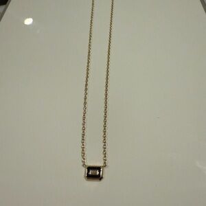 Elegant Gold Necklace with Black Pendant